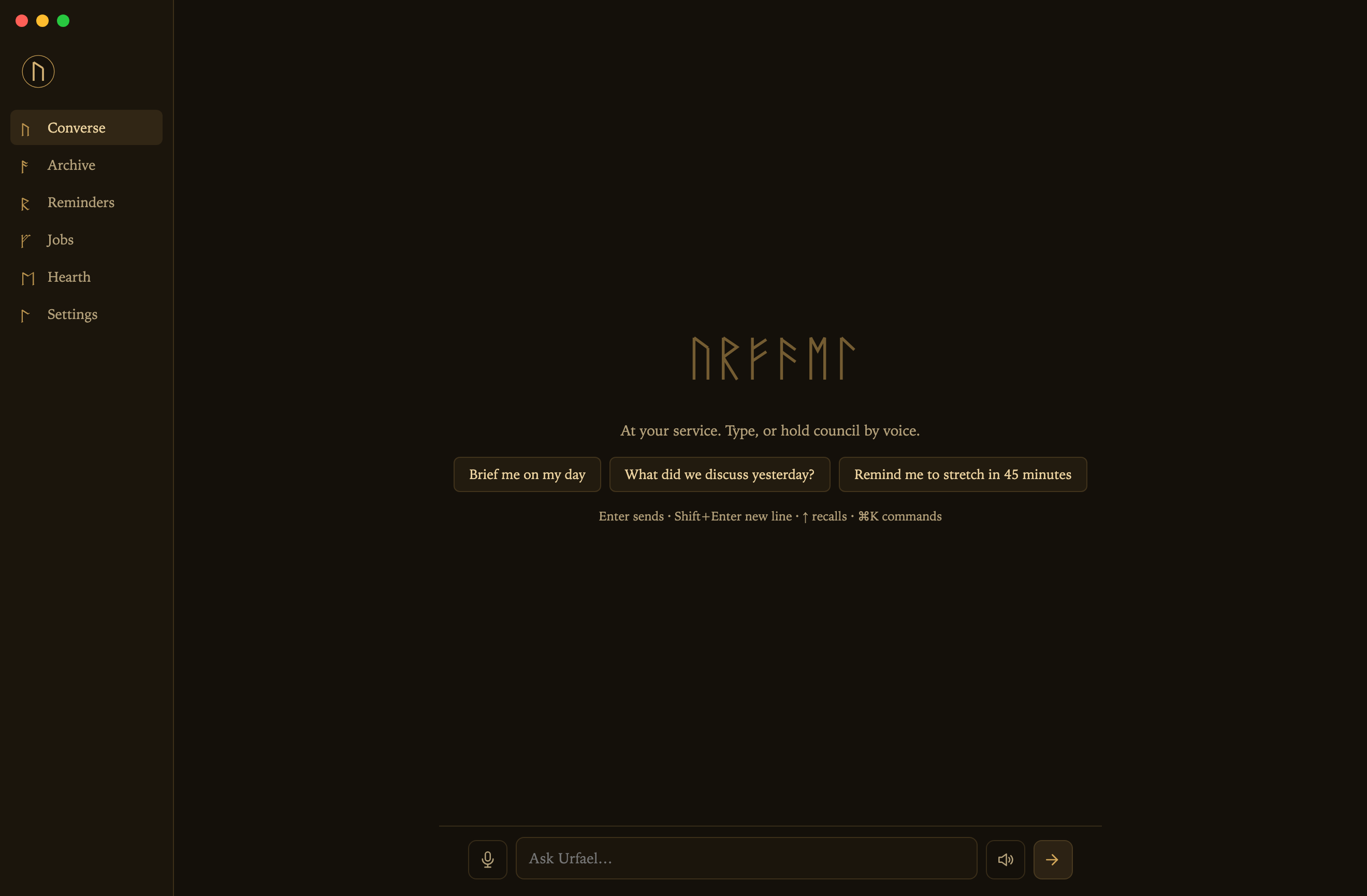 The Urfael Console, a gold-on-dark desktop app: sidebar of views, runic identity, voice and type input
