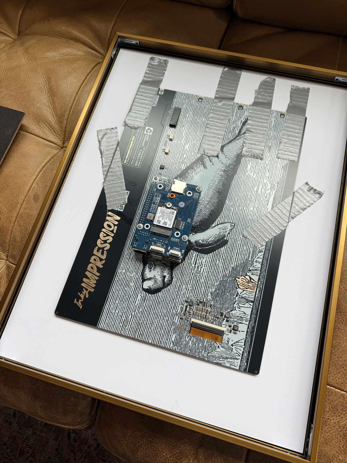 Open back of the framed display during assembly, with the panel and CM4 carrier visible