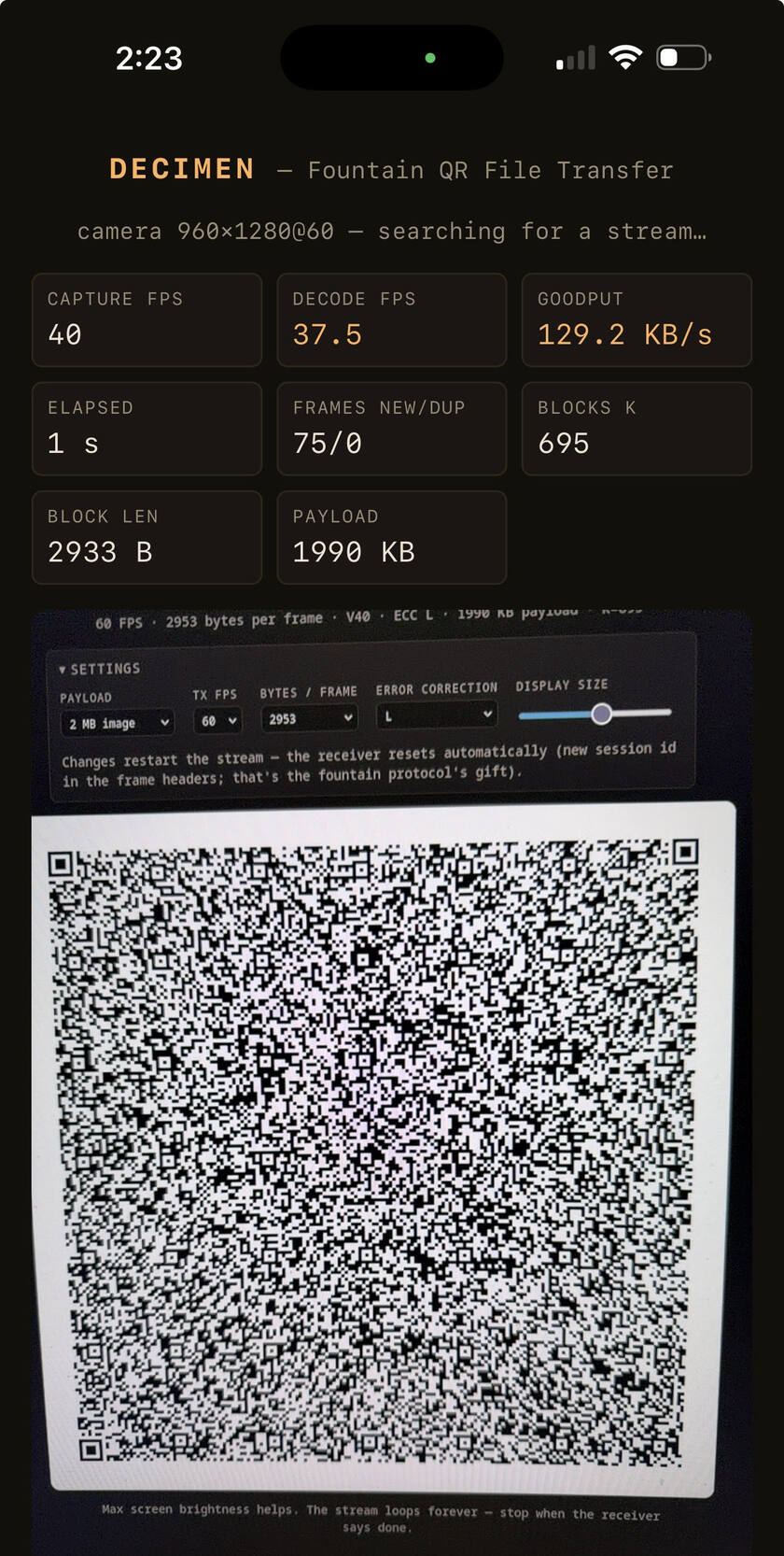 Phone receiving a 2 MB image over light: 129.2 KB/s goodput, decoding the sender's animated QR code