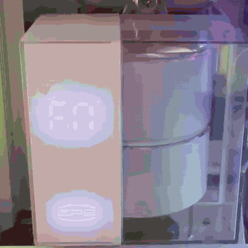 The pump head running the OpenDS360 startup sequence: every segment lit, a fast sweep, deceleration, an overshoot past the target, and a settle onto the measured temperature